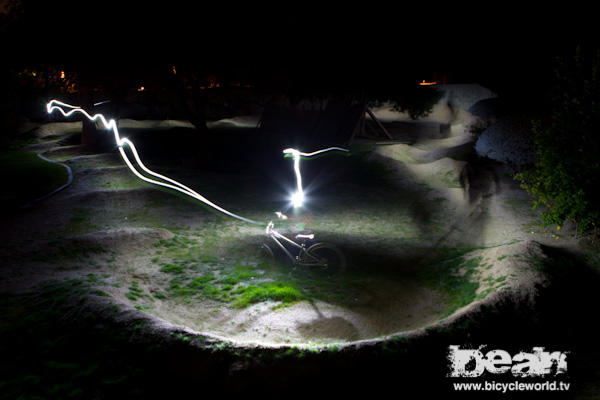 riding the Bicycle World TV pump track using Candle Powers - trail torch 188